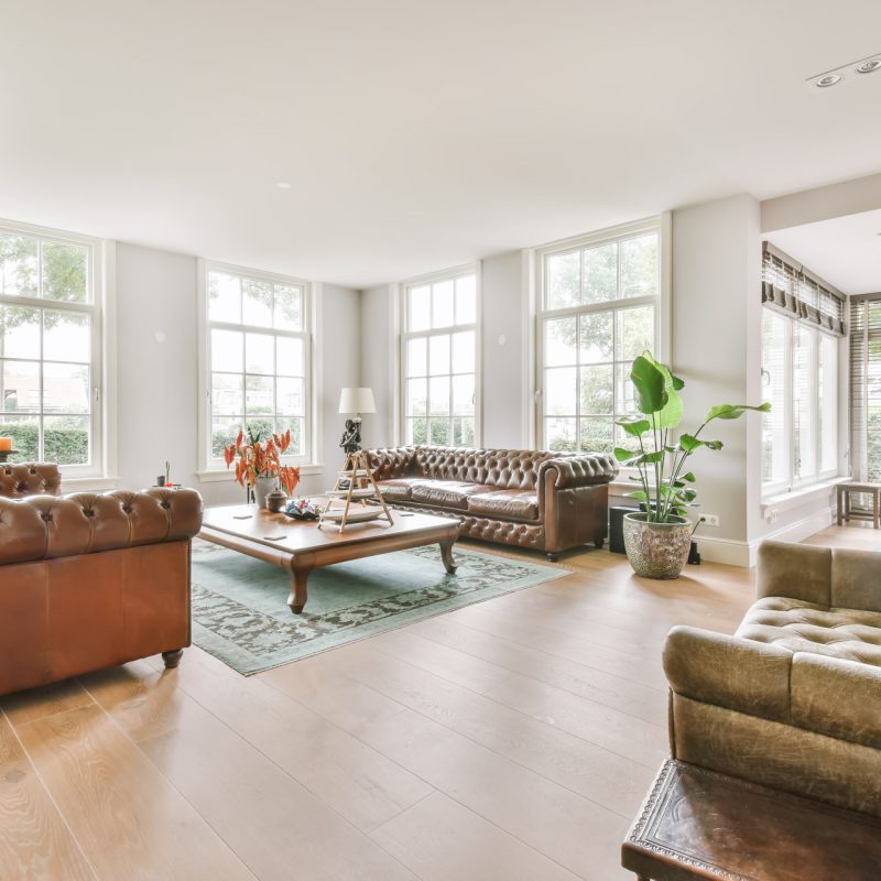 Luxurious living room with soft sofa and armchairs